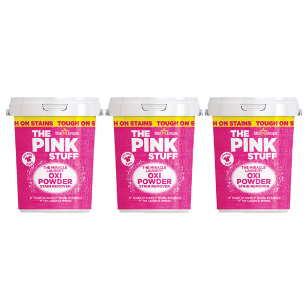 Three 2.2lb containers of Star Drops 3 Pack - The Pink Stuff Miracle Laundry Oxi Powder Stain Remover for Colors are displayed side by side, each with a bright pink label and white lid.